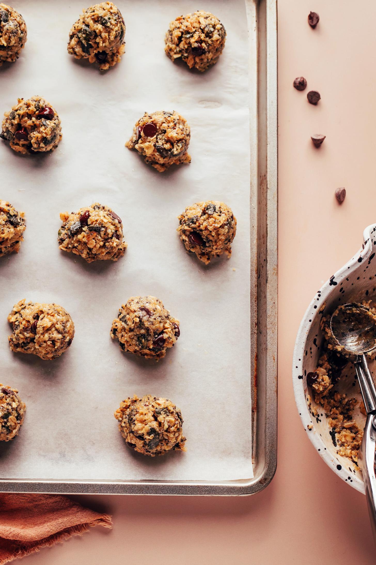 Breakfast cookie dough balls on a parchment-lined baking sheet