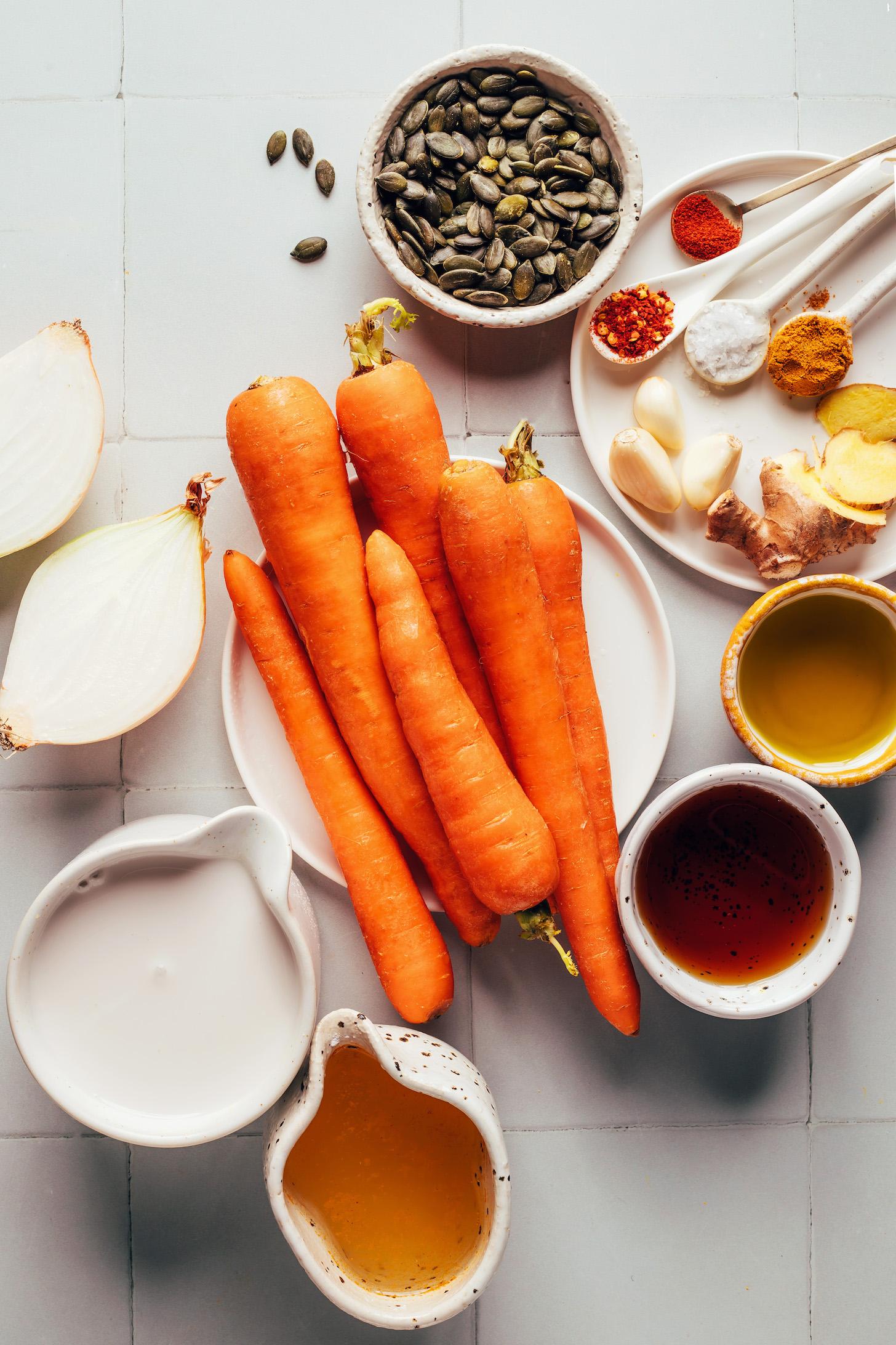 Carrots, onions, pepitas, spices, ginger, garlic, oil, vegetable broth, maple syrup, and coconut milk