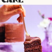 Using a fork to cut into a slice of gluten-free vegan chocolate cake