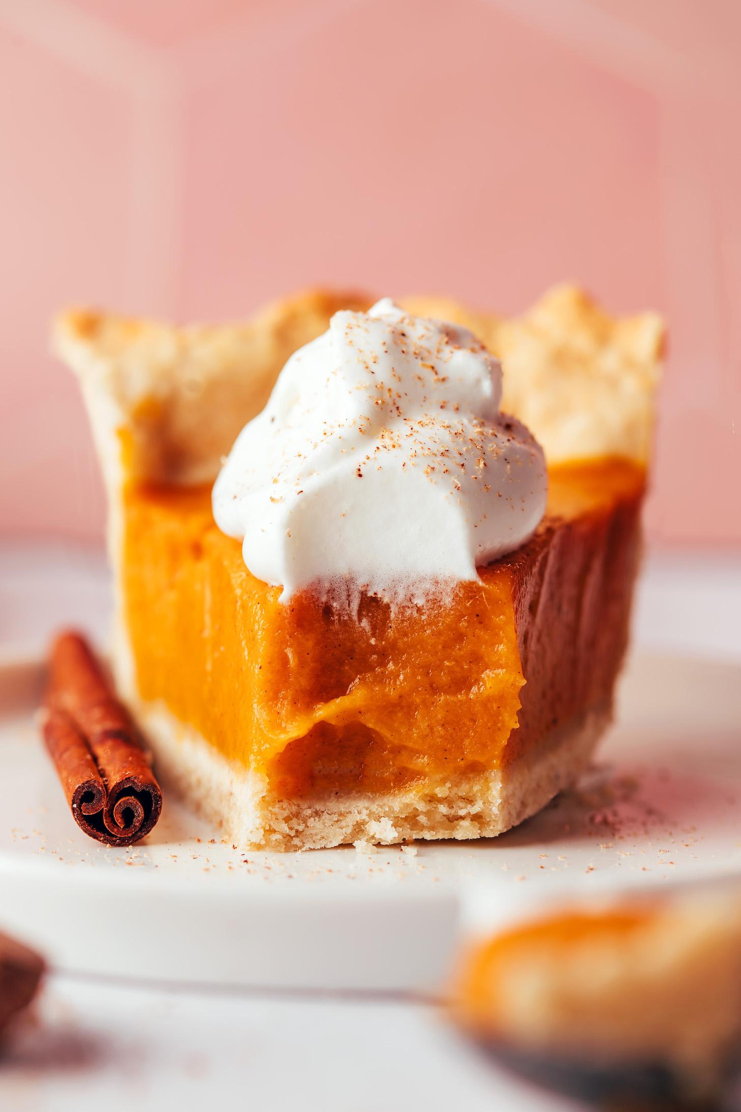 Slice of vegan gluten-free sweet potato pie with a bite removed