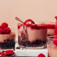 Dessert glasses filled with our No-Bake Vegan Chocolate Cheesecake recipe