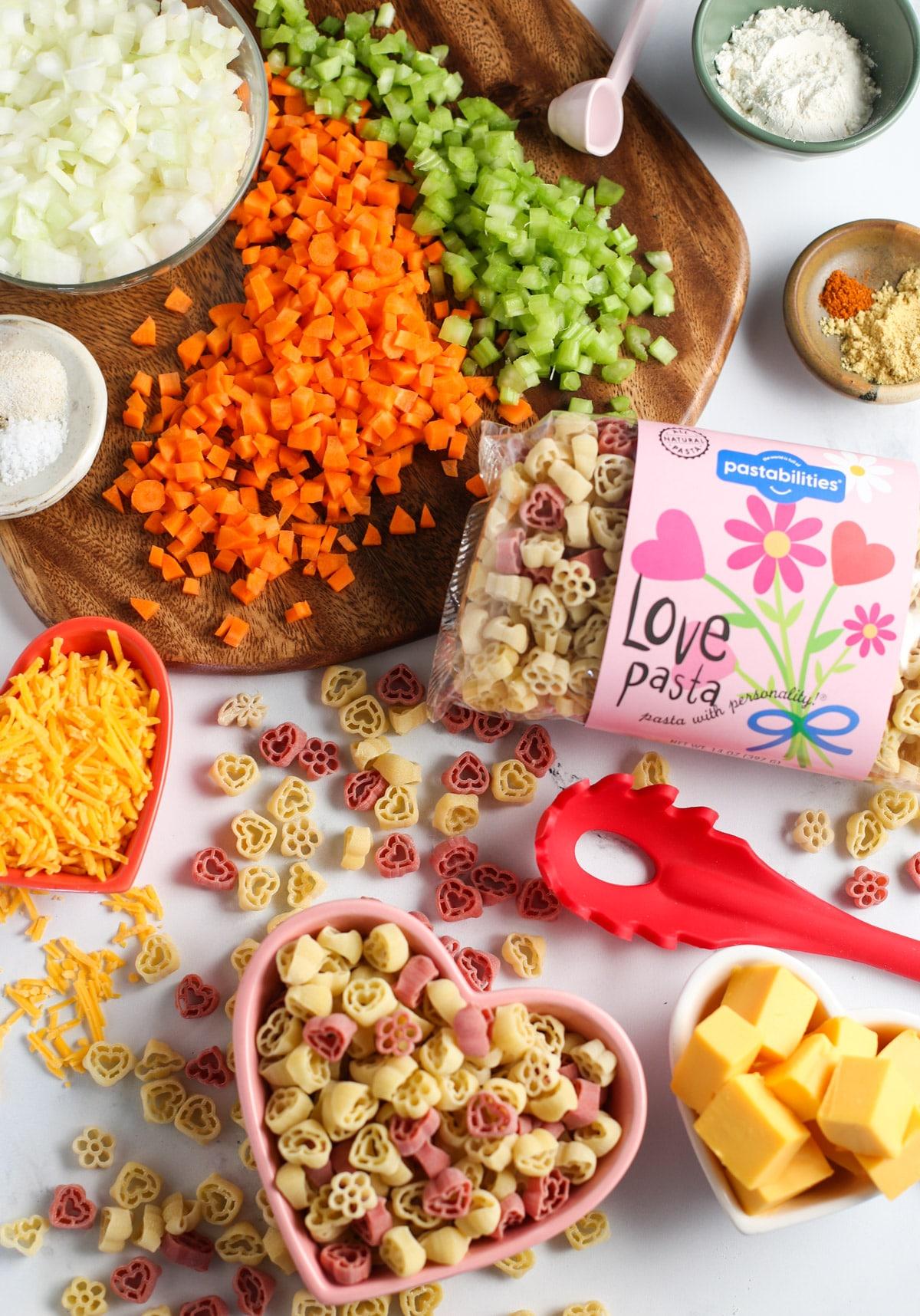 Mac and Cheese Soup ingredients spread out on a cutting board