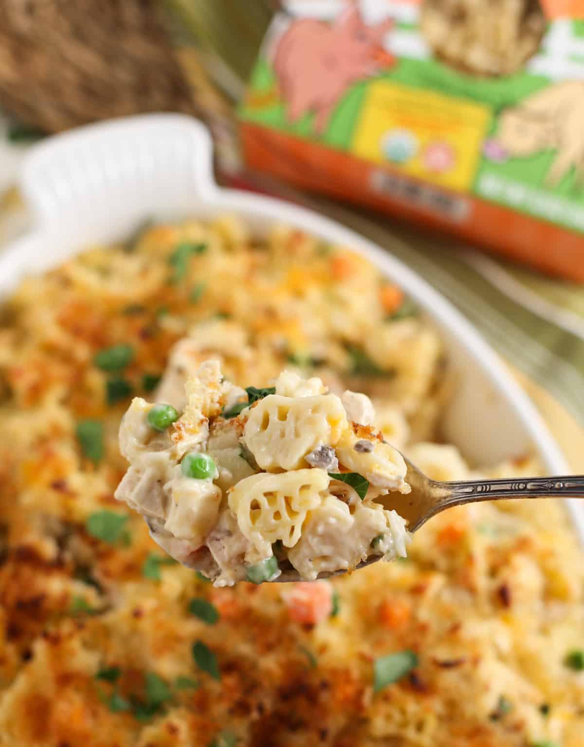 close up of cow shaped pasta with casserole on spoon