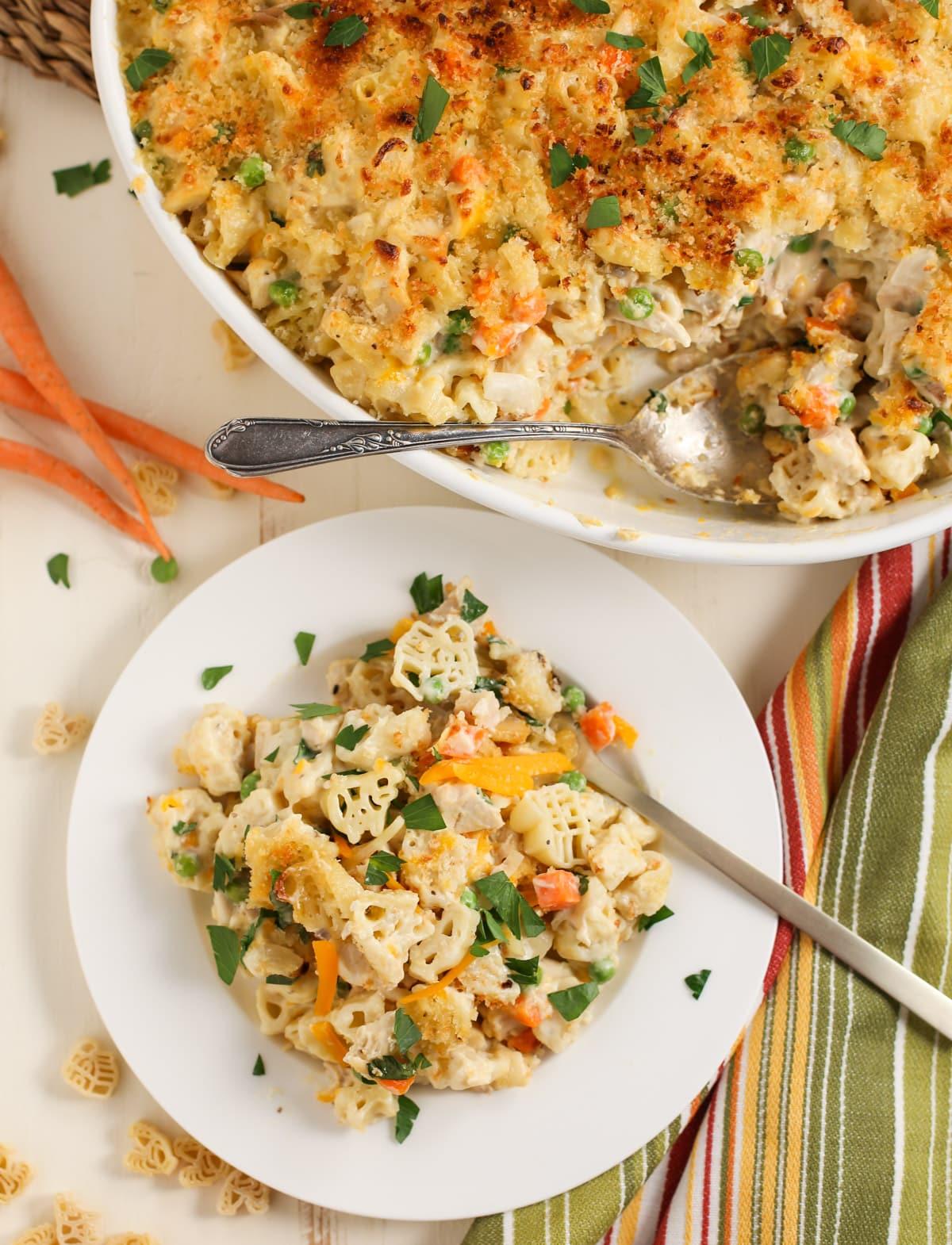 Serving of chicken noodle casserole on white plate.