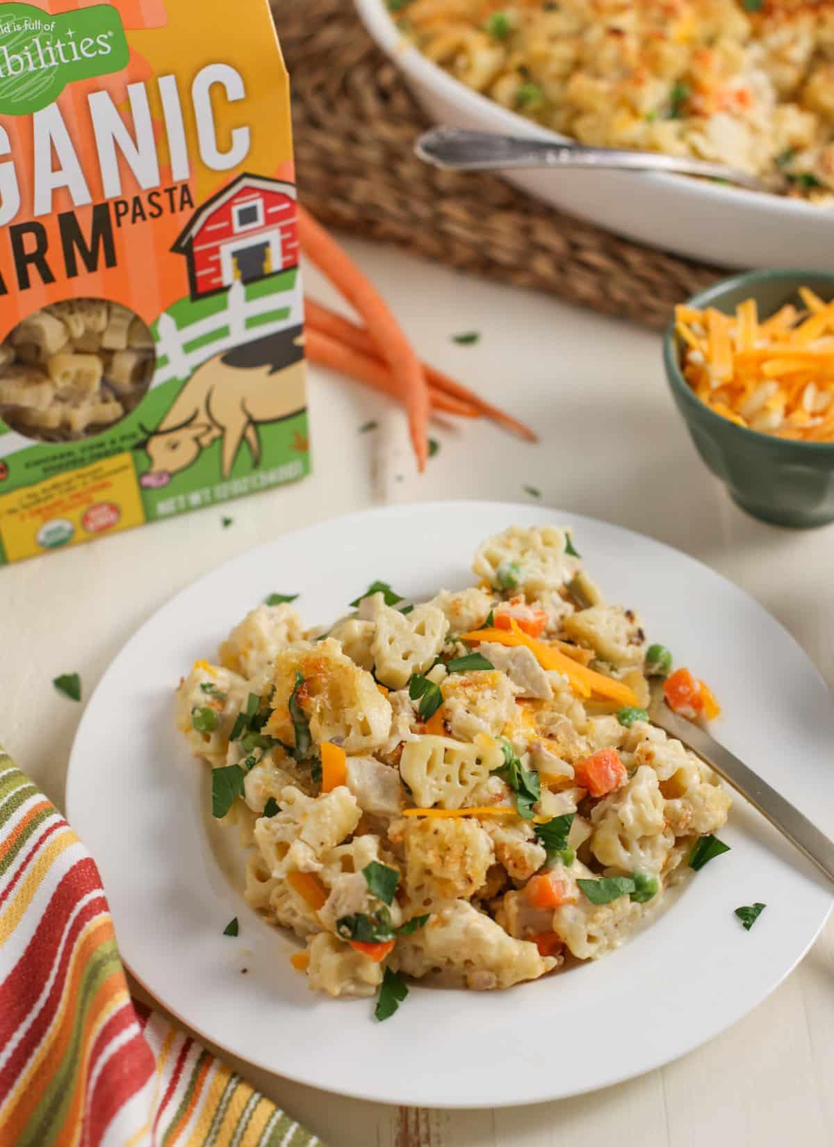 Plate of casserole with Organic Farm Pasta box and casserole dish in background,