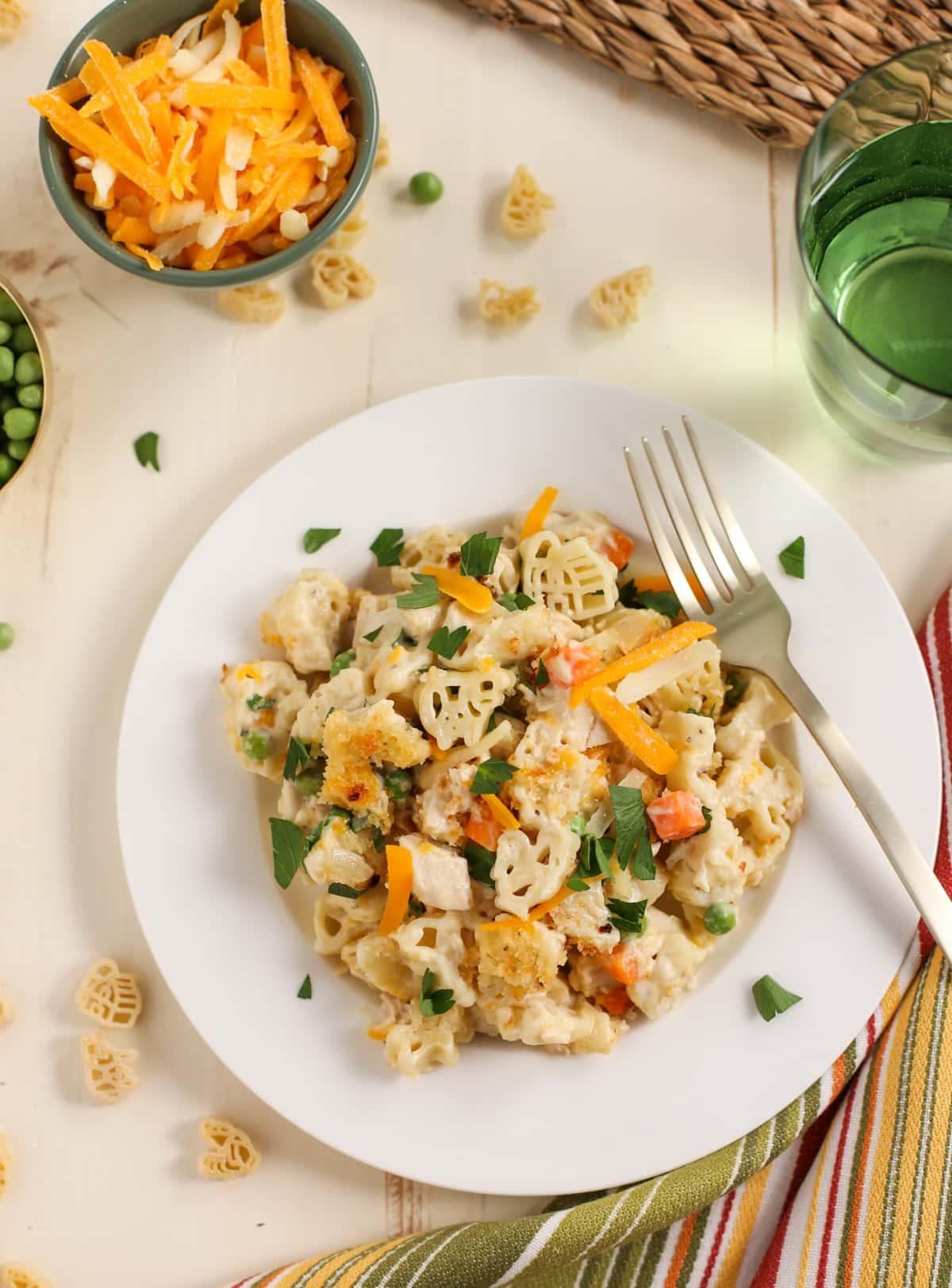 Overhead shot of plate of chicken noodle casserole highlighting pasta shapes.