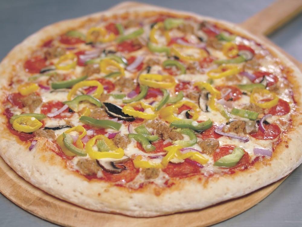 freshly baked pizza with various peppers