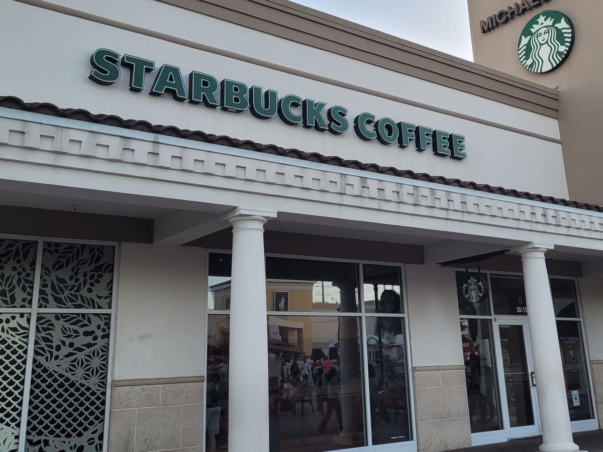 A Starbucks coffee shop offering heart-healthy and fast food options, with a sign on the front.