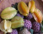 star fruits and custard apples in a market