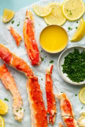 King Crab Legs with butter and lemon wedges