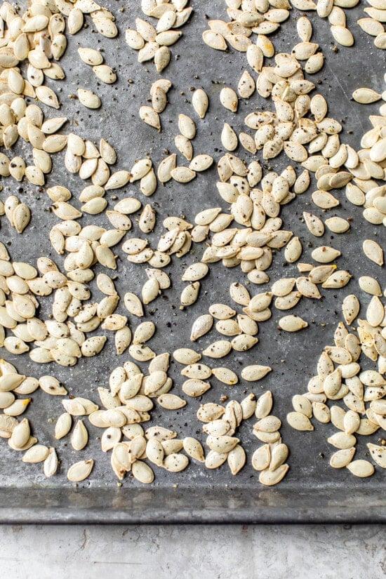 pumpkin seeds on baking sheet