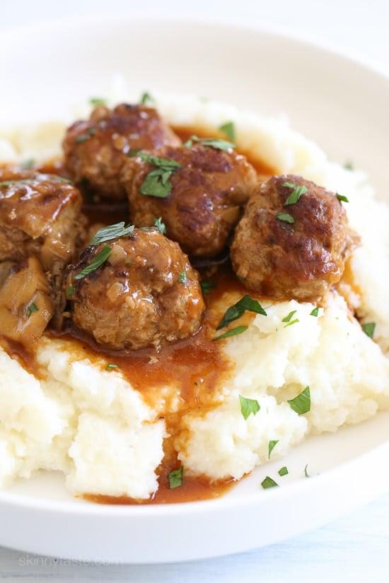 These beefy meatballs are cooked in a mushroom gravy and lightened up by using half ground turkey and half lean ground beef.