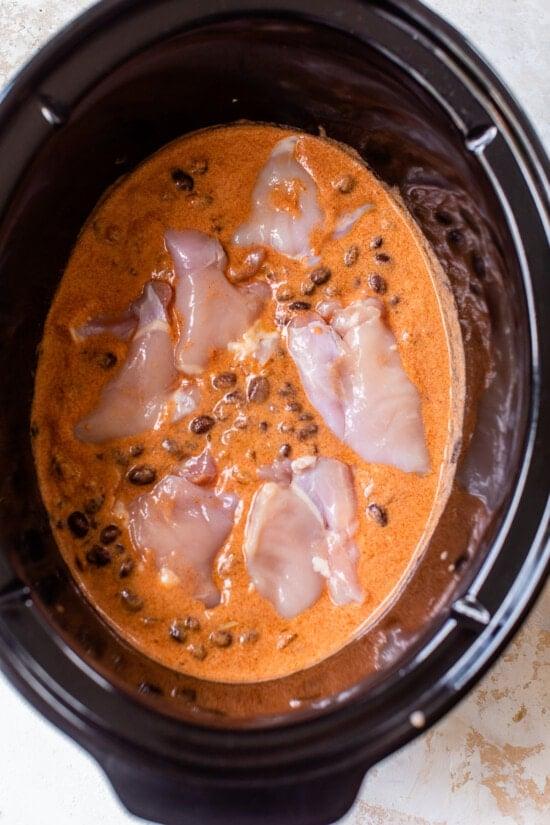 chicken, enchilada sauce, beans in slow cooker