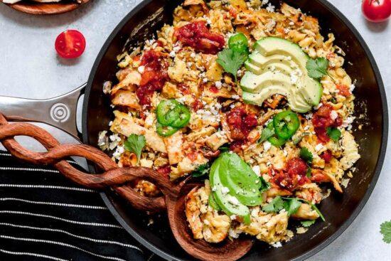 Migas is a popular Tex Mex egg dish made with chopped corn tortillas, cheese, tomatoes, jalapeños, and onions. I serve it plated with tortillas on the side, but they can also be wrapped in a tortilla, taco style.