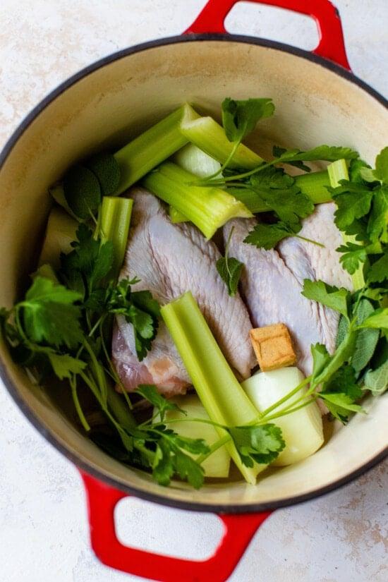 Turkey Stock Ingredients in a Dutch Oven