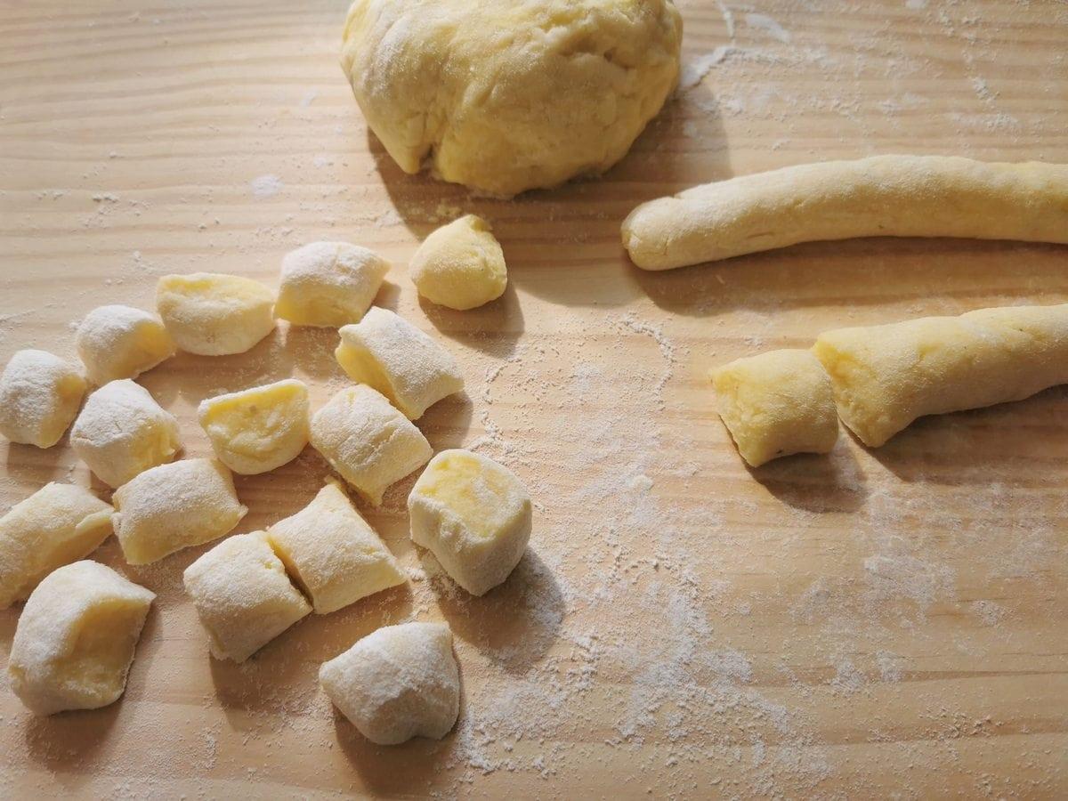 Gnocchi dough rolled into long rope and cut into gnocchi.
