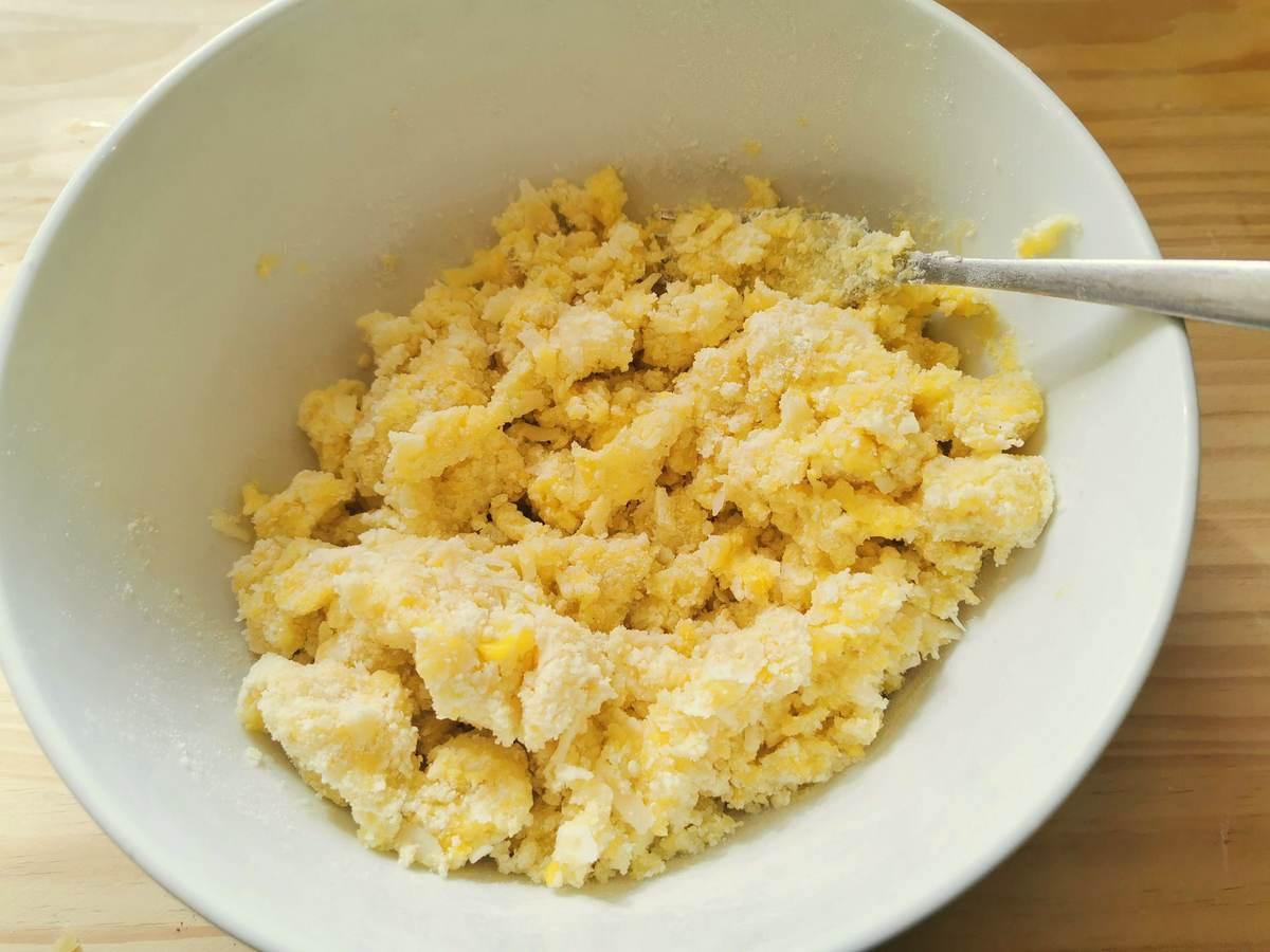 Potato gnocchi ingredients mixed together in a bowl.
