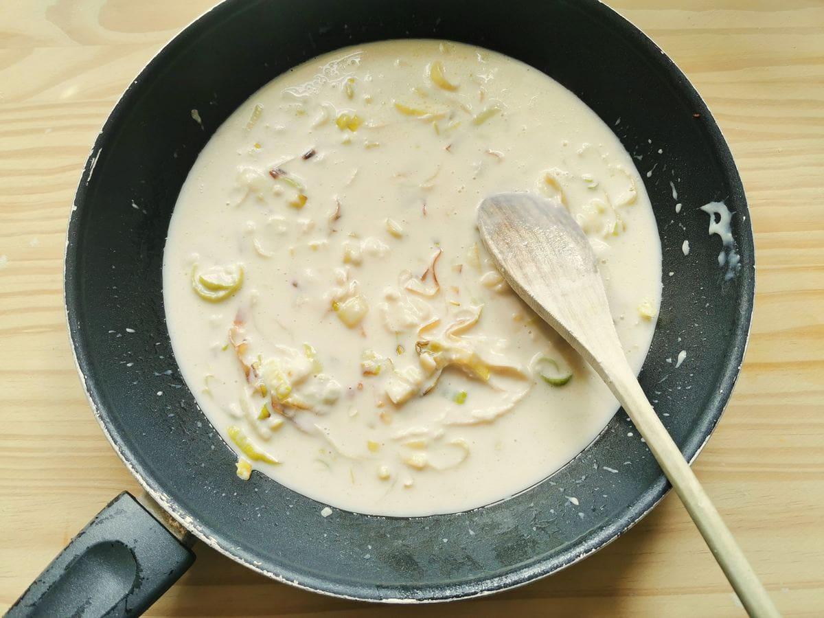 Cheese and leek sauce in skillet.