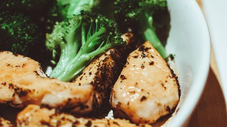 Close up shot of chicken and broccoli