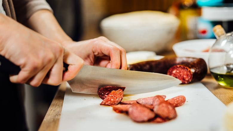 Cutting cured meat