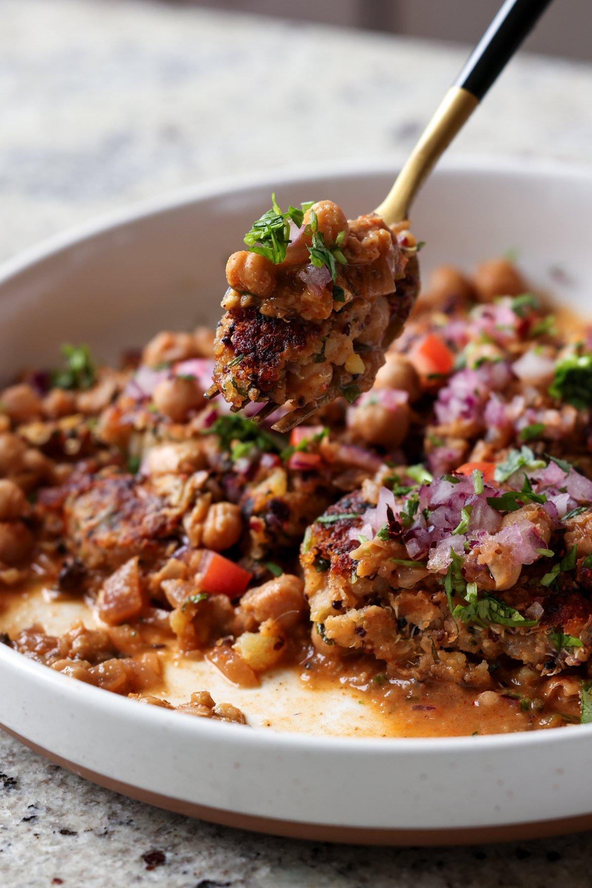 fork taking a bite of tikki chole