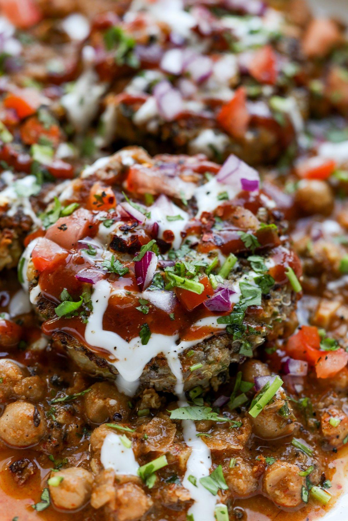 extreme close-up of the potato patty with toppings